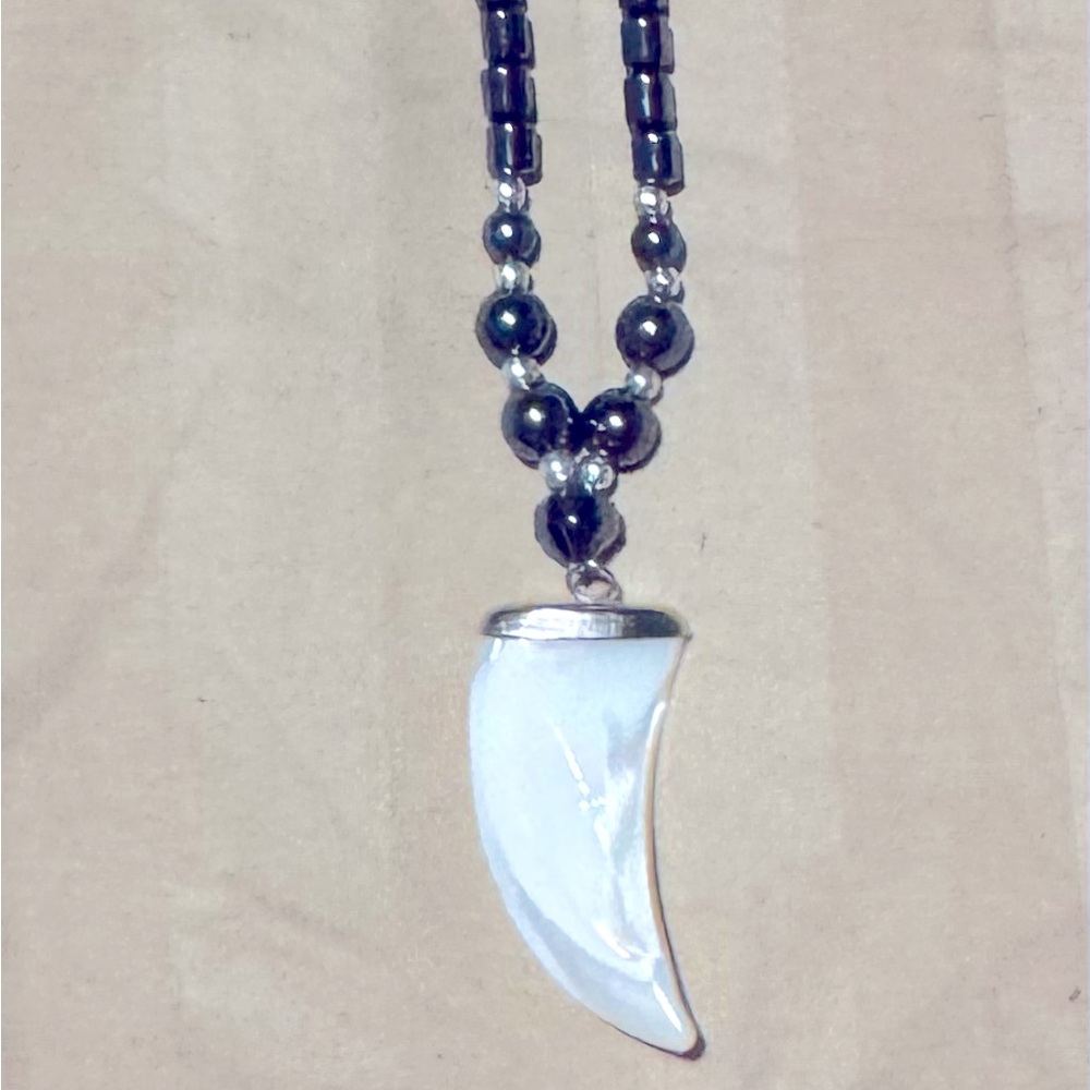 Hematite necklace Mother of pearl carved claw pendant